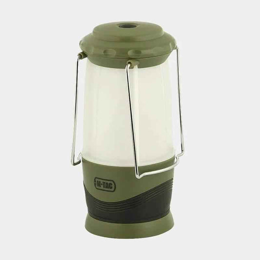 Linterna portátil con cuerpo translúcido blanco y asa metálica, acabado verde mate