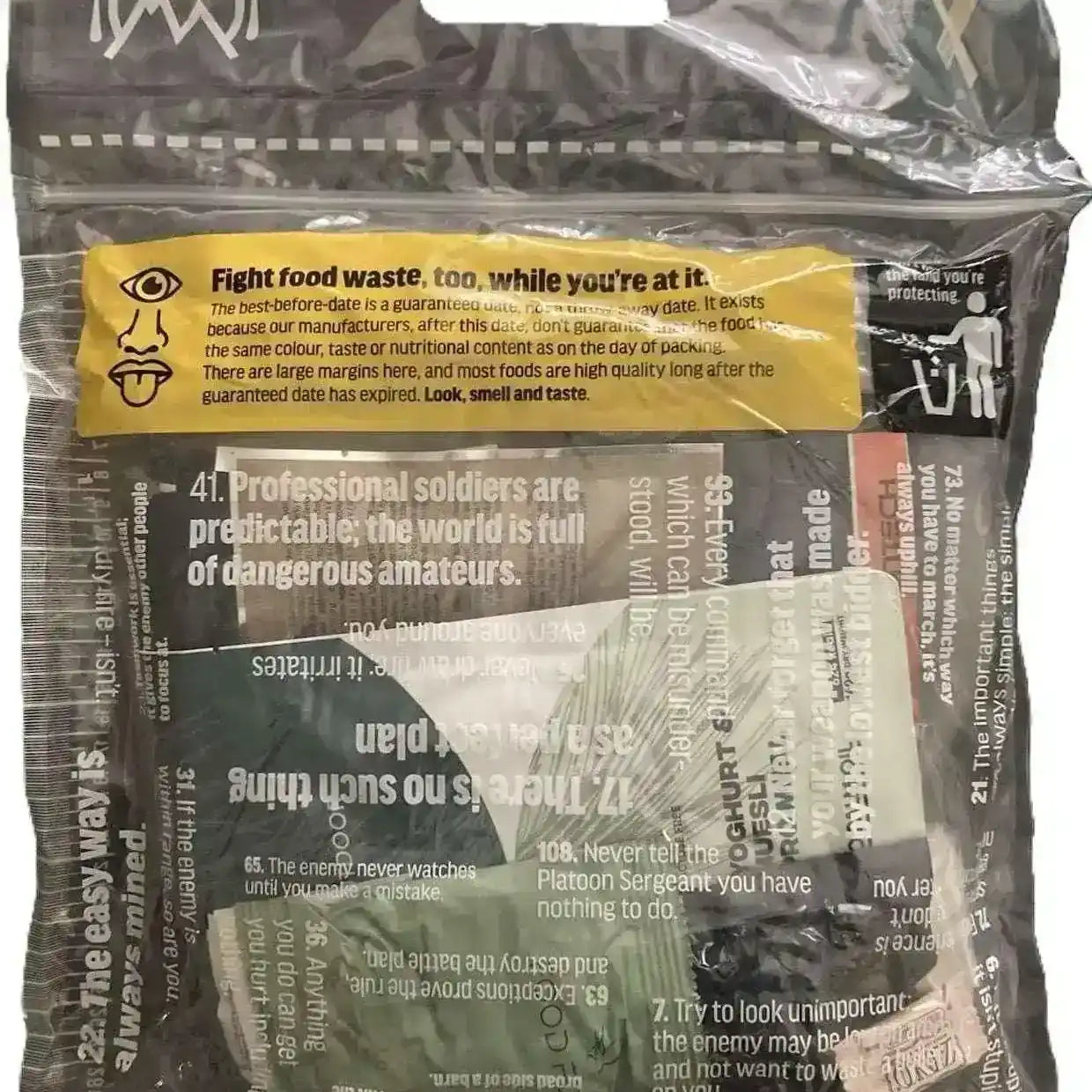 Bolsa MRE con texto de seguridad en amarillo y negro, frente visible.