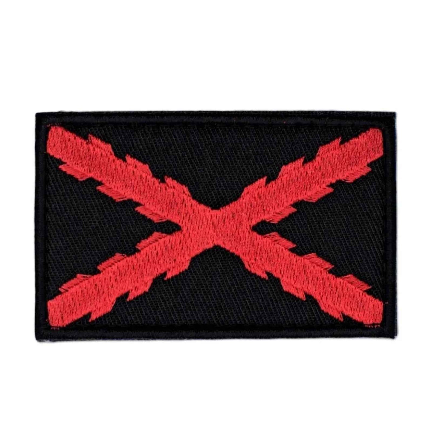 Parche rectangular negro con X roja bordada